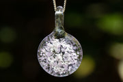 icy pendant with cremation ash